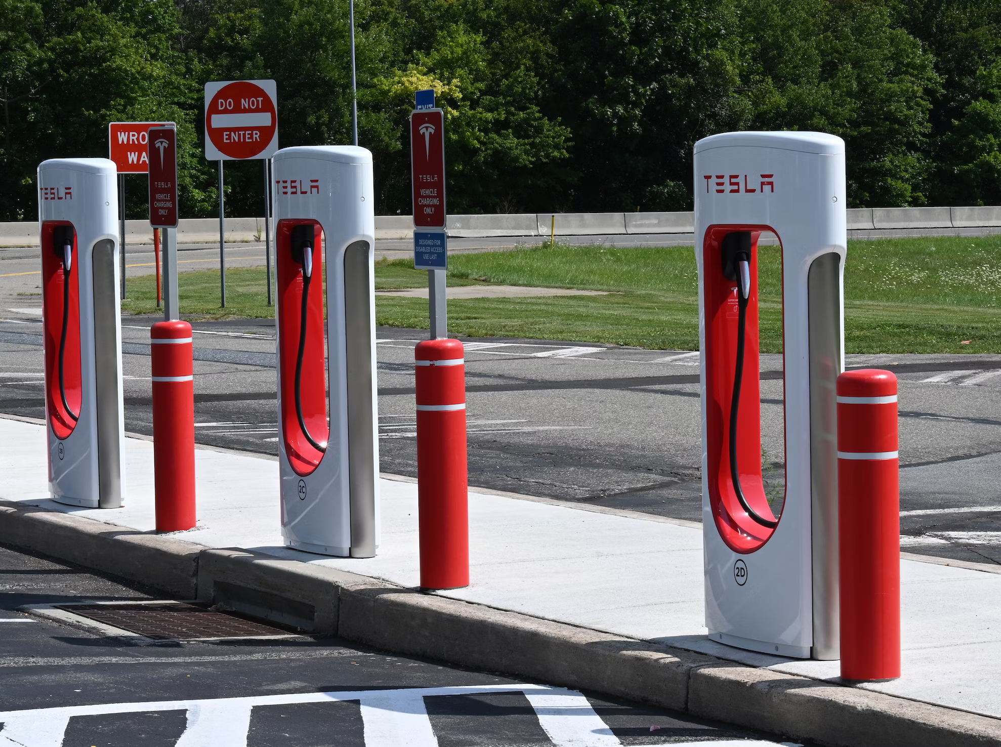 What is Tesla supercharger cost of development?